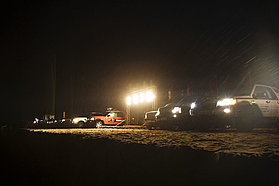 Land rovers light up the beach