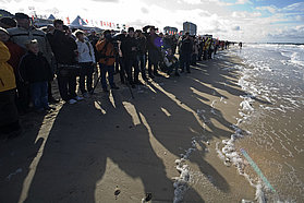 The crowds line the shoreline