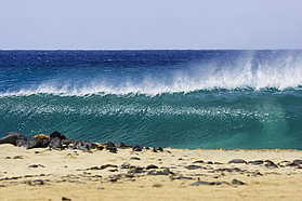Another perfect wave reels down the point at Ponta Preta