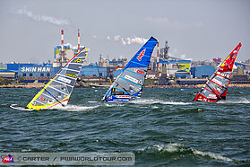 Racing in front of the huge shipyards