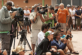 The press gather