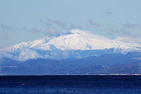 Mount Etna looms in the distance