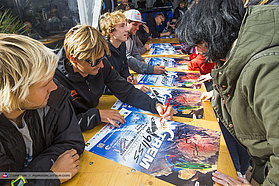Flo signing autographs