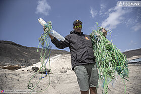 Ricardo picking up the trash