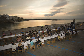 Sailors enjoy a meal in the ambience of L'Escala Costa Brava